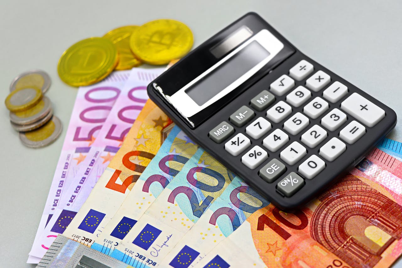 Euro Banknotes with Cryptocurrency and a Calculator